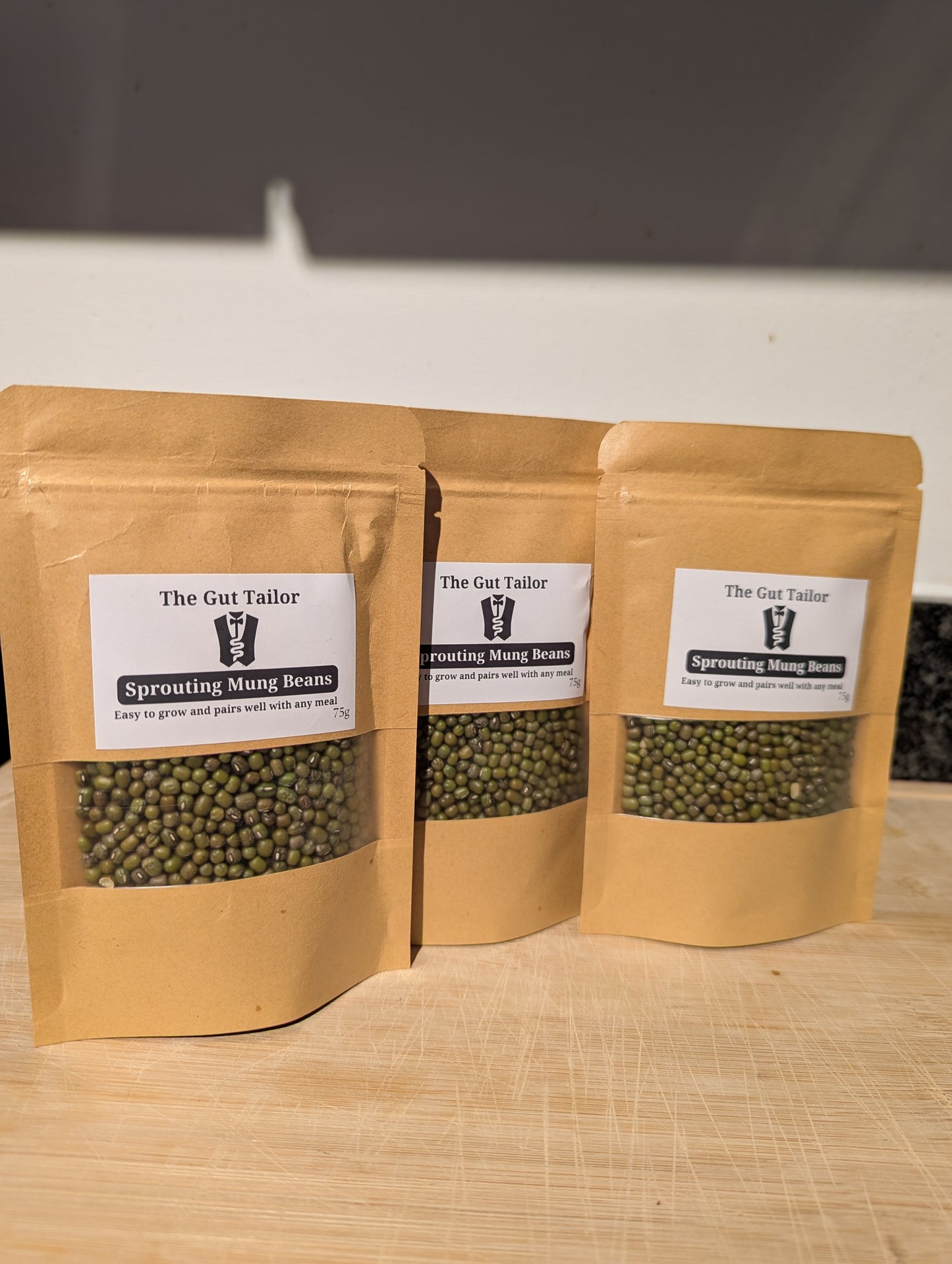 Three stand up pouches containing sprouting beans