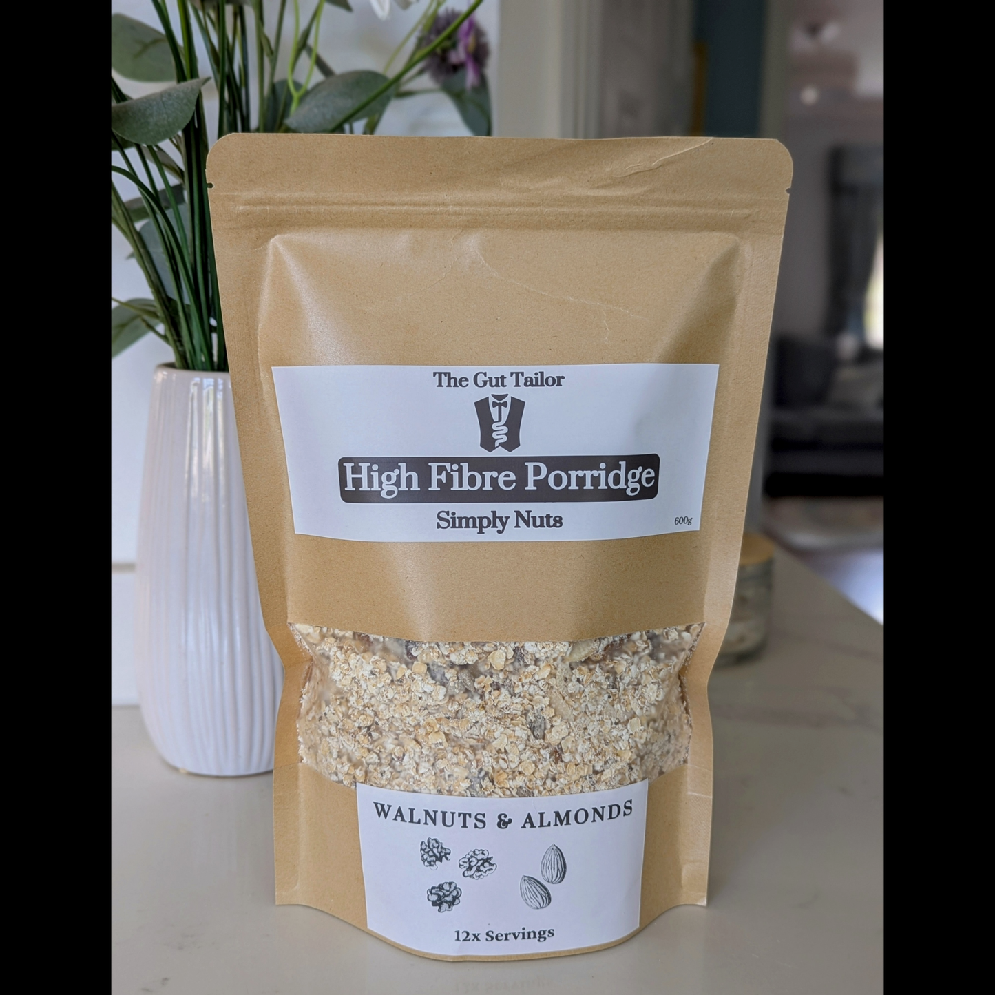 Bag of High Fibre Porridge with 'The Gut Tailor' branding on a neutral background
