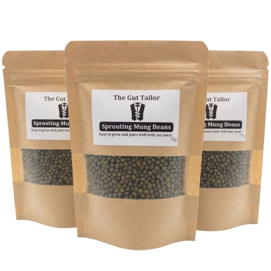 Three packages of 'The Gut Tailor' sprouting mung beans on a white background