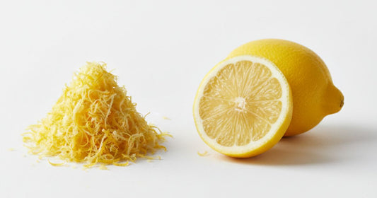 Close-up of lemon peel zest on white surface showing citrus peel benefits and natural citrus peel extract for digestive health