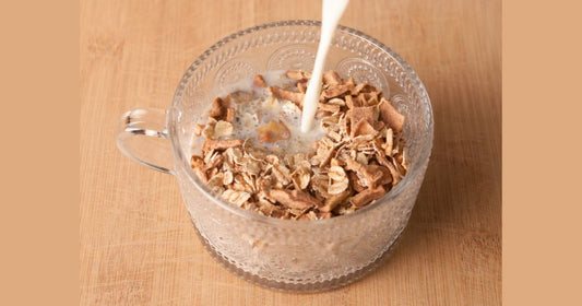 Milk being poured into a bowl of gut friendly oats