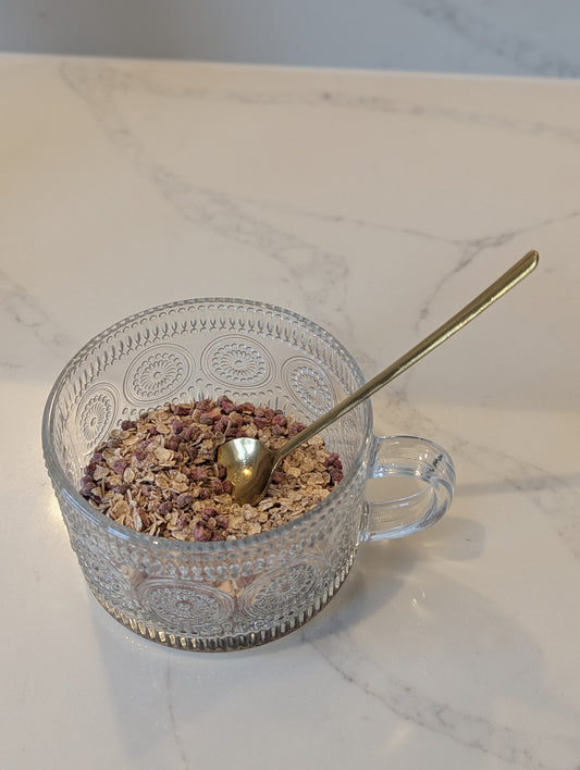 Clear glass mug with textured design filled with low FODMAP porridge