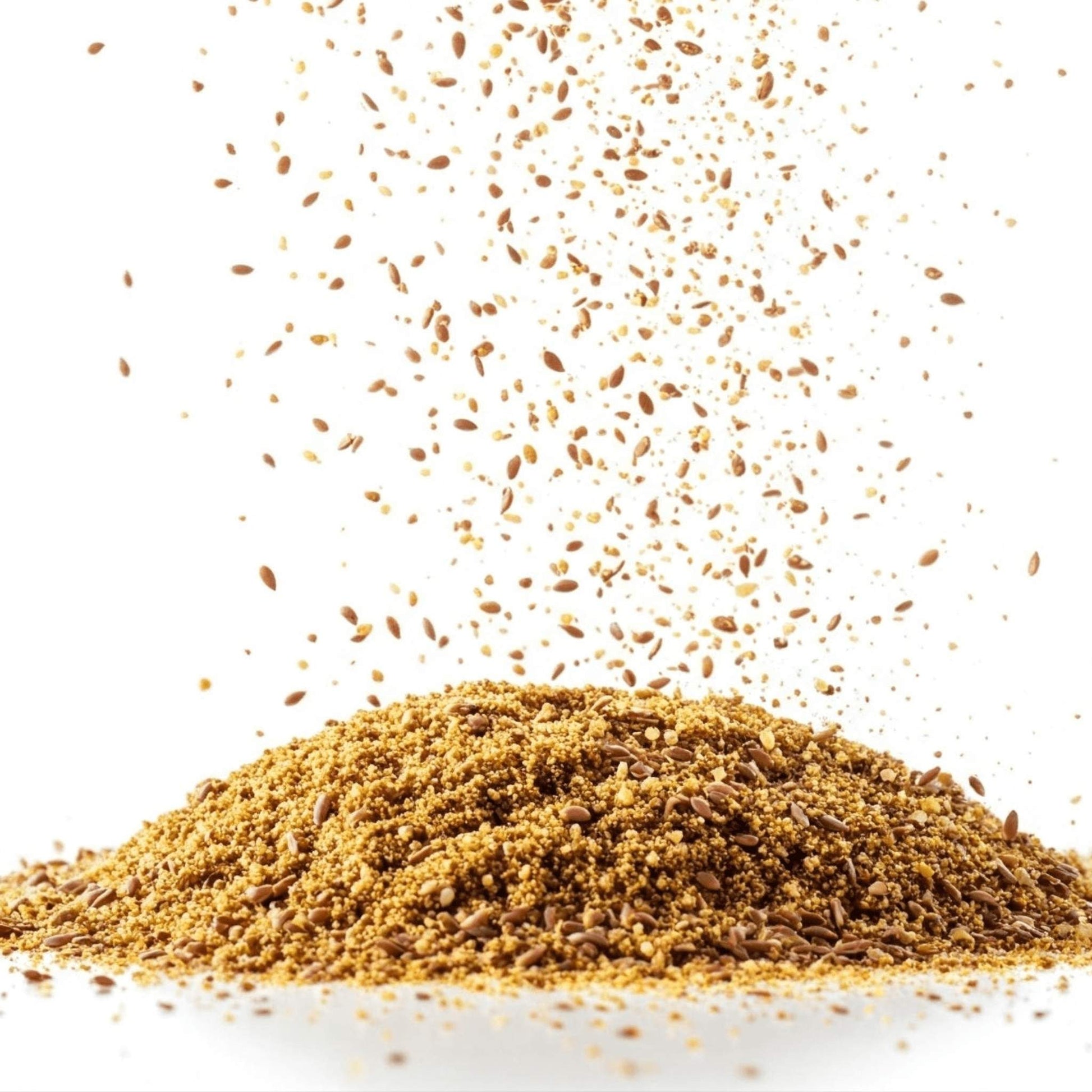 Flaxseed being poured into a pile on a white background