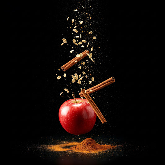 An apple, cinnamon, and oats falling on black background