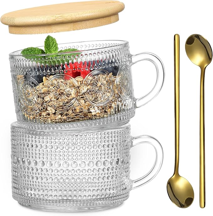Clear glass mug with textured design, wooden lid, and gold spoons on a white background