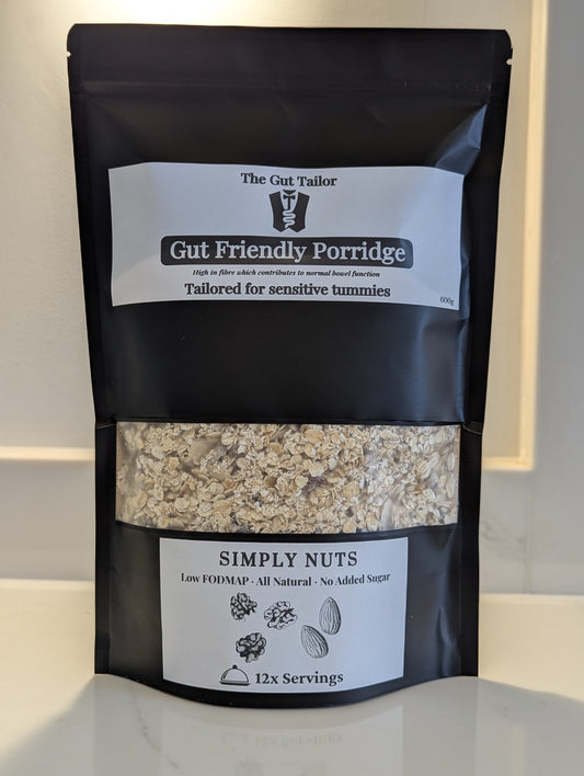 Black package of Gut Friendly Porridge with visible contents on a light background