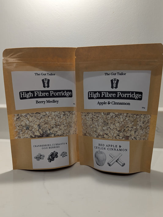Two packages of High Fibre Porridge from The Gut Tailor on a white background